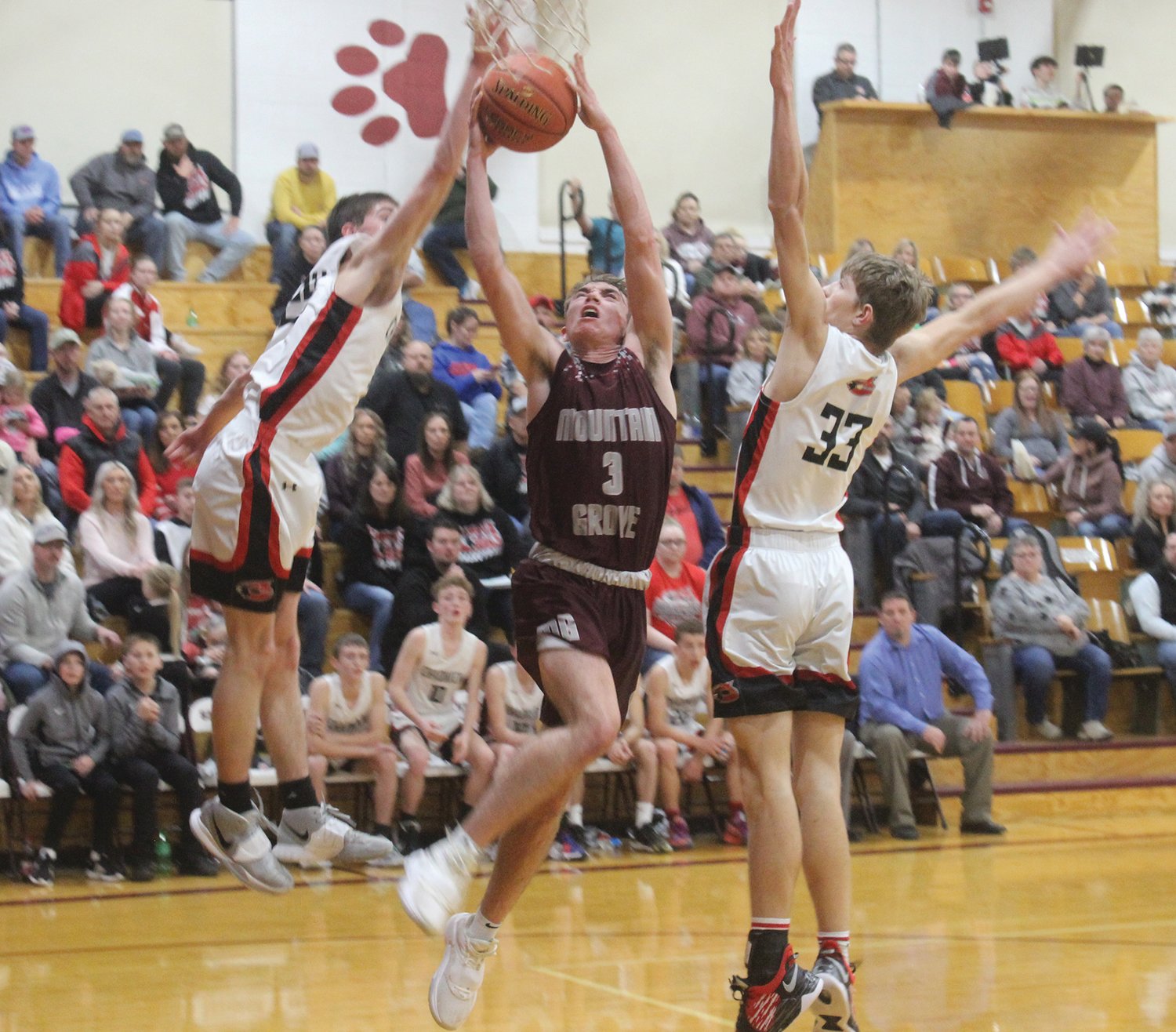 Mountain Grove’s Hollen Glenn gets fouled on this shot during a rough Chadwick game in The Seymour Bank’s Winter Classic. Game featured 51 turnovers.